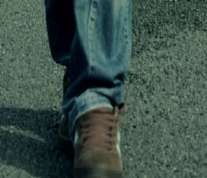 An image of a man walking heel to toe