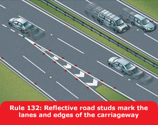 Reflective road studs mark the lanes and edges of the carriageway